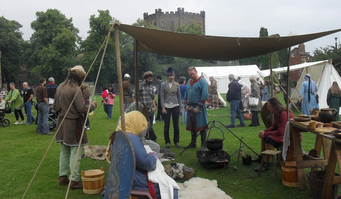 Palace Green in the late eleventh century was probably bustling with activity. This Norman reenactment group on the green in 2010, gives an indication of what it may have been like. (Especially if you can ignore the modern-day visitors, the grass, and the fact that the Castle keep looked different then).